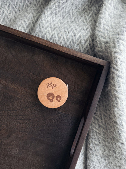 Uttrekkbart målebånd i tre